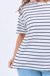 A model wearing the Fundamental Winona Stripe Cotton Tee in colour Whitenavy (White), from the front, cropped image