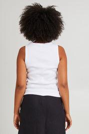 Model Olivia wearing size 10 of the Fundamental Rib Cotton Vee Tank in colour White (White), from the back