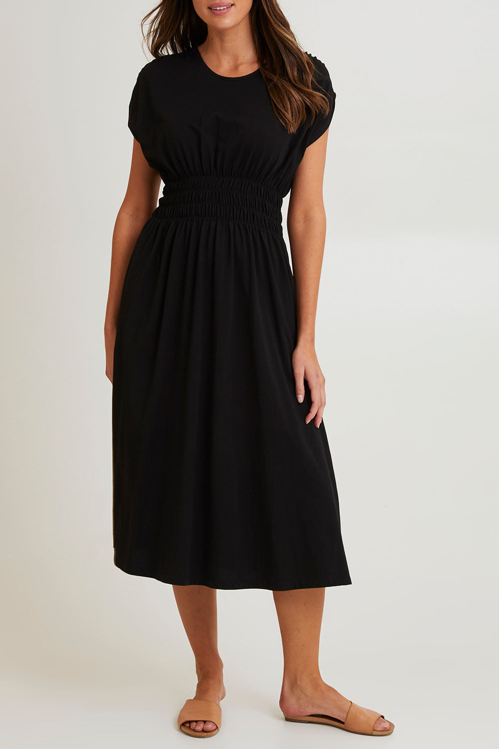 Model Madeline wearing size 10 of the Fundamental Nelle Cotton Midi Dress in colour Black (Black), from the front, cropped image