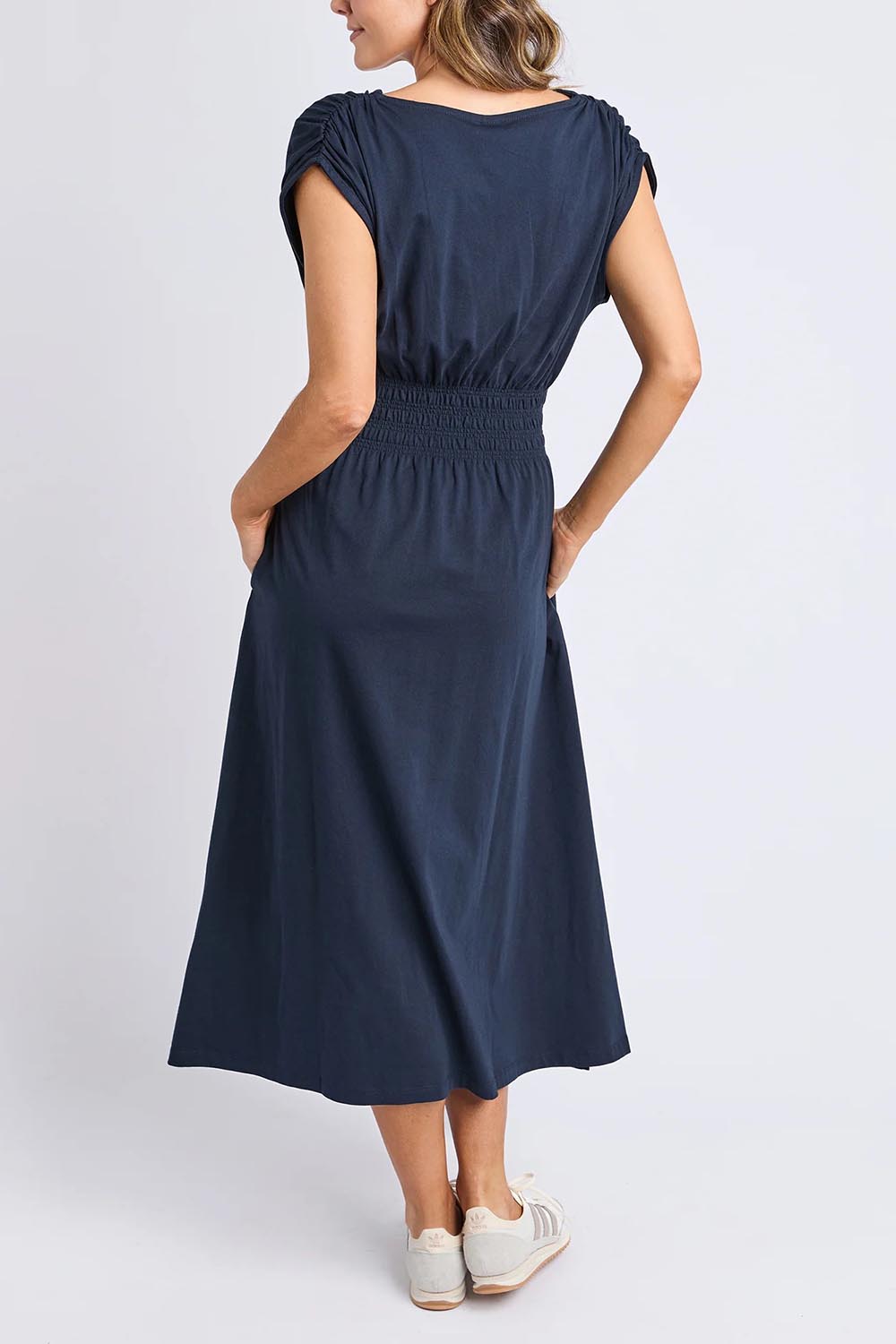 A model wearing the Fundamental Nelle Cotton Midi Dress in colour Navy (Blue), from the back