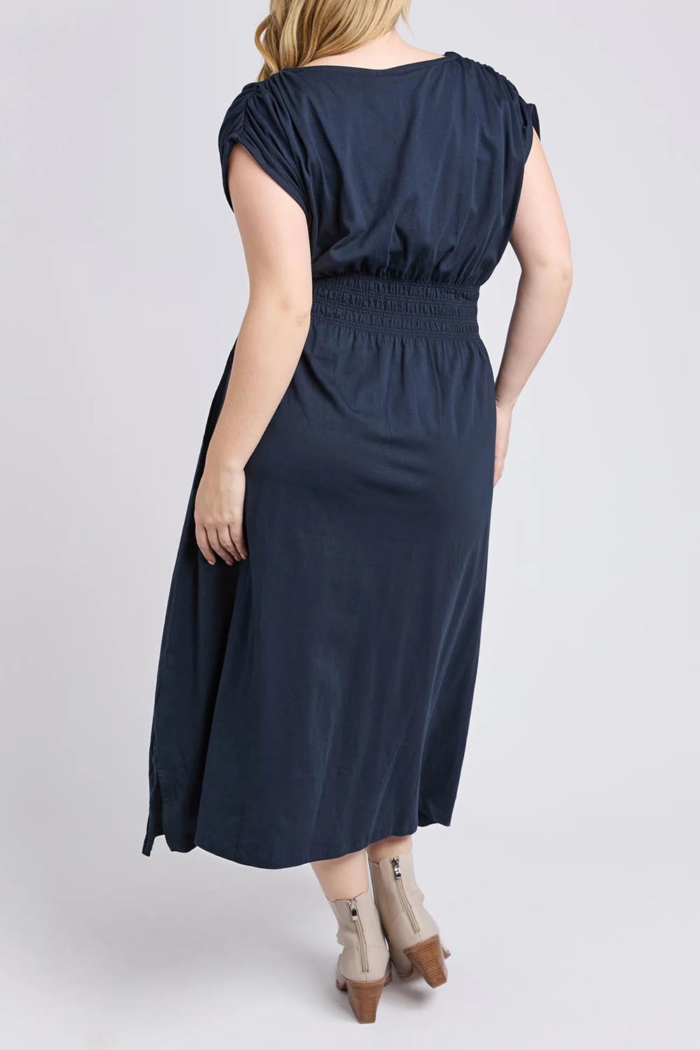 A model wearing the Fundamental Nelle Cotton Midi Dress in colour Navy (Blue), from the back