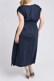 A model wearing the Fundamental Nelle Cotton Midi Dress in colour Navy (Blue), from the back