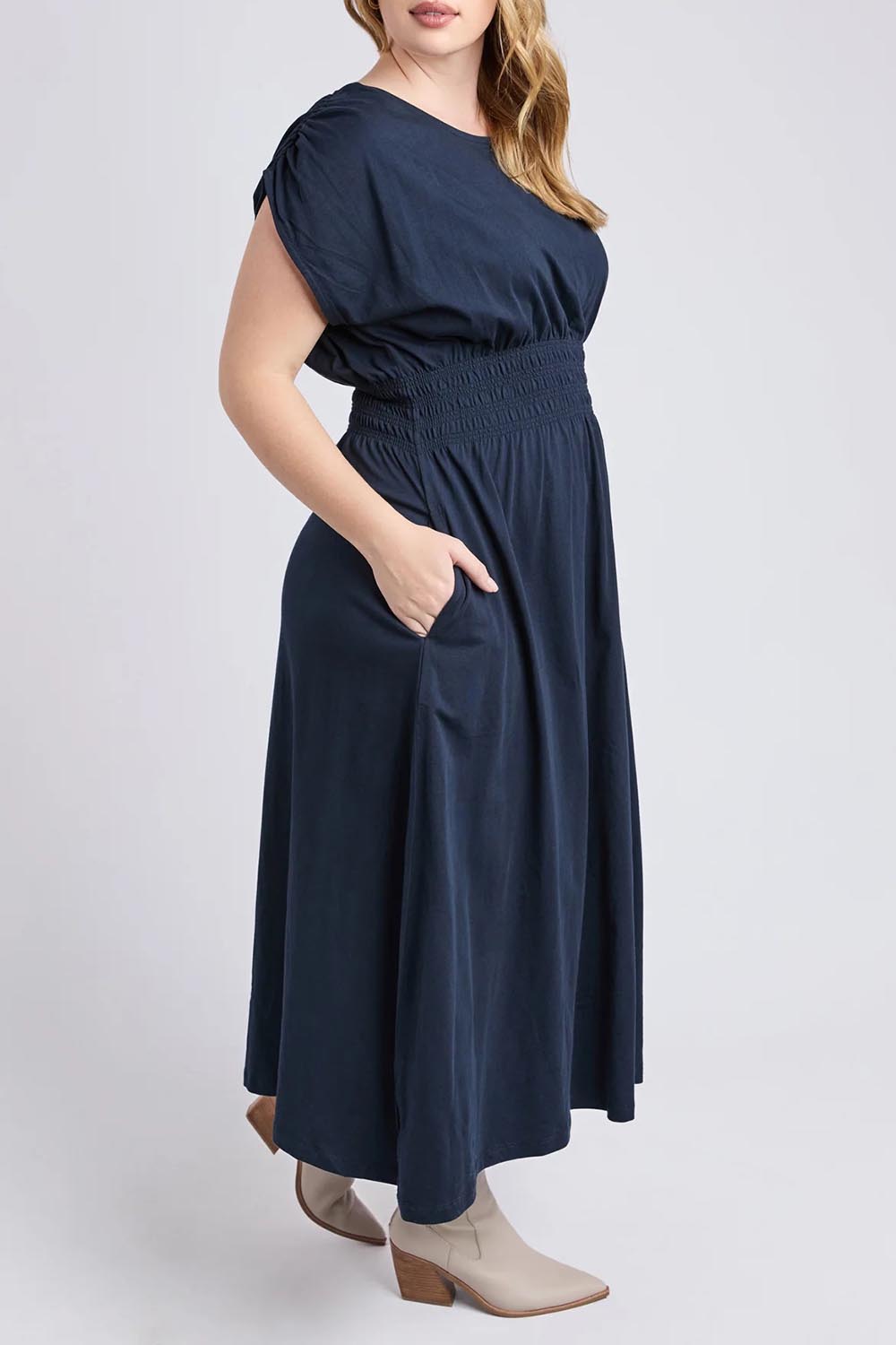 A model wearing the Fundamental Nelle Cotton Midi Dress in colour Navy (Blue), from the front, cropped image
