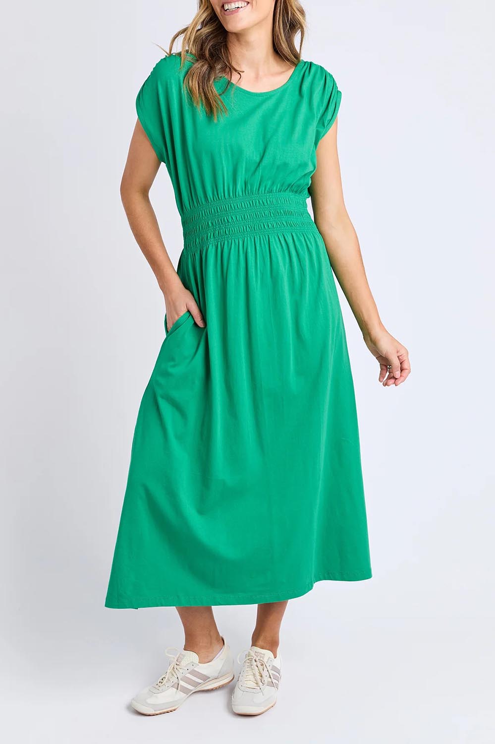 A model wearing the Fundamental Nelle Cotton Midi Dress in colour Pinegreen (Green), from the front, cropped image
