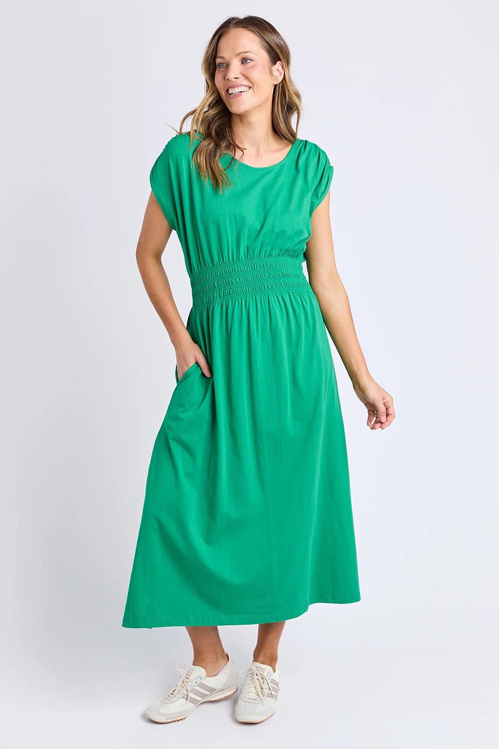 A model wearing the Fundamental Nelle Cotton Midi Dress in colour Pinegreen (Green), from the front, showing the whole outfit
