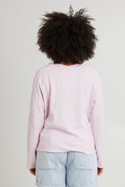 Model Olivia wearing size 10 of the Fundamental Chris Ls Sweat in colour Pinkaboo (Pink), from the back