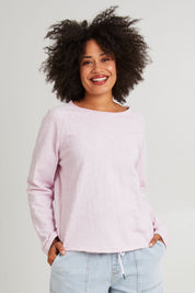 Model Olivia wearing size 10 of the Fundamental Chris Ls Sweat in colour Pinkaboo (Pink), from the front, cropped image