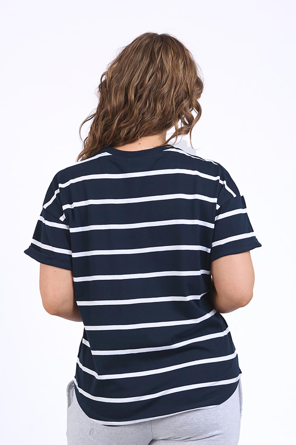 A model wearing the Fundamental Halli Cotton Short Sleeve Tee in colour Navyst (Blue), from the back
