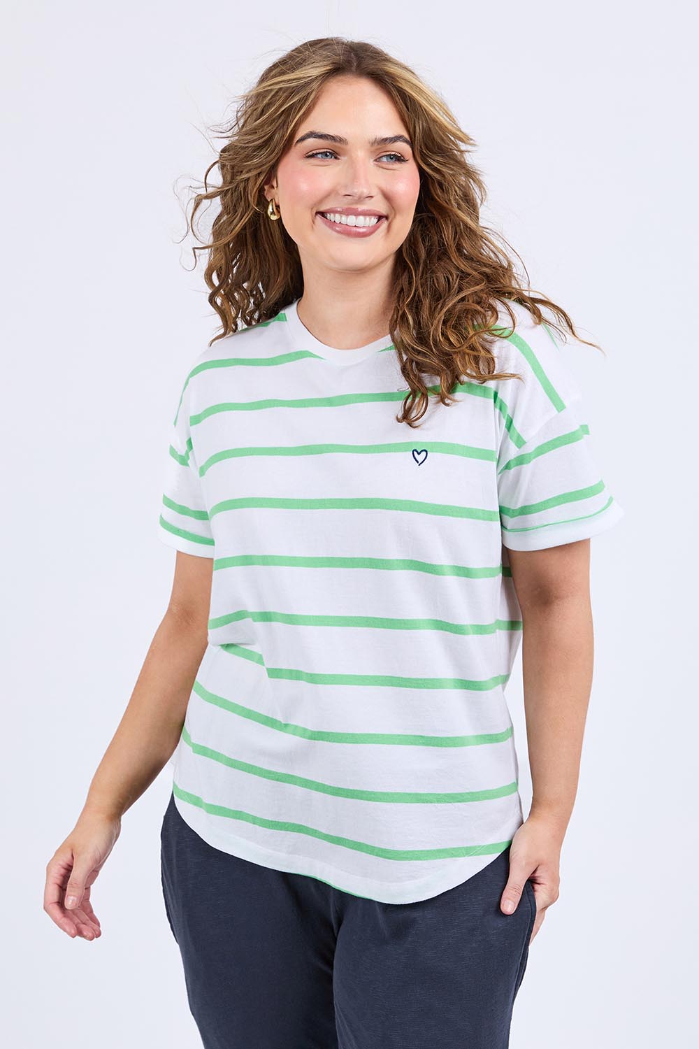 A model wearing the Fundamental Halli Cotton Short Sleeve Tee in colour Whitegreen (White), from the front, cropped image