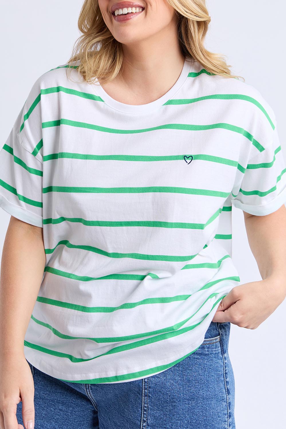 A model wearing the Fundamental Halli Cotton Short Sleeve Tee in colour Whitegreen (White), from the front, cropped image