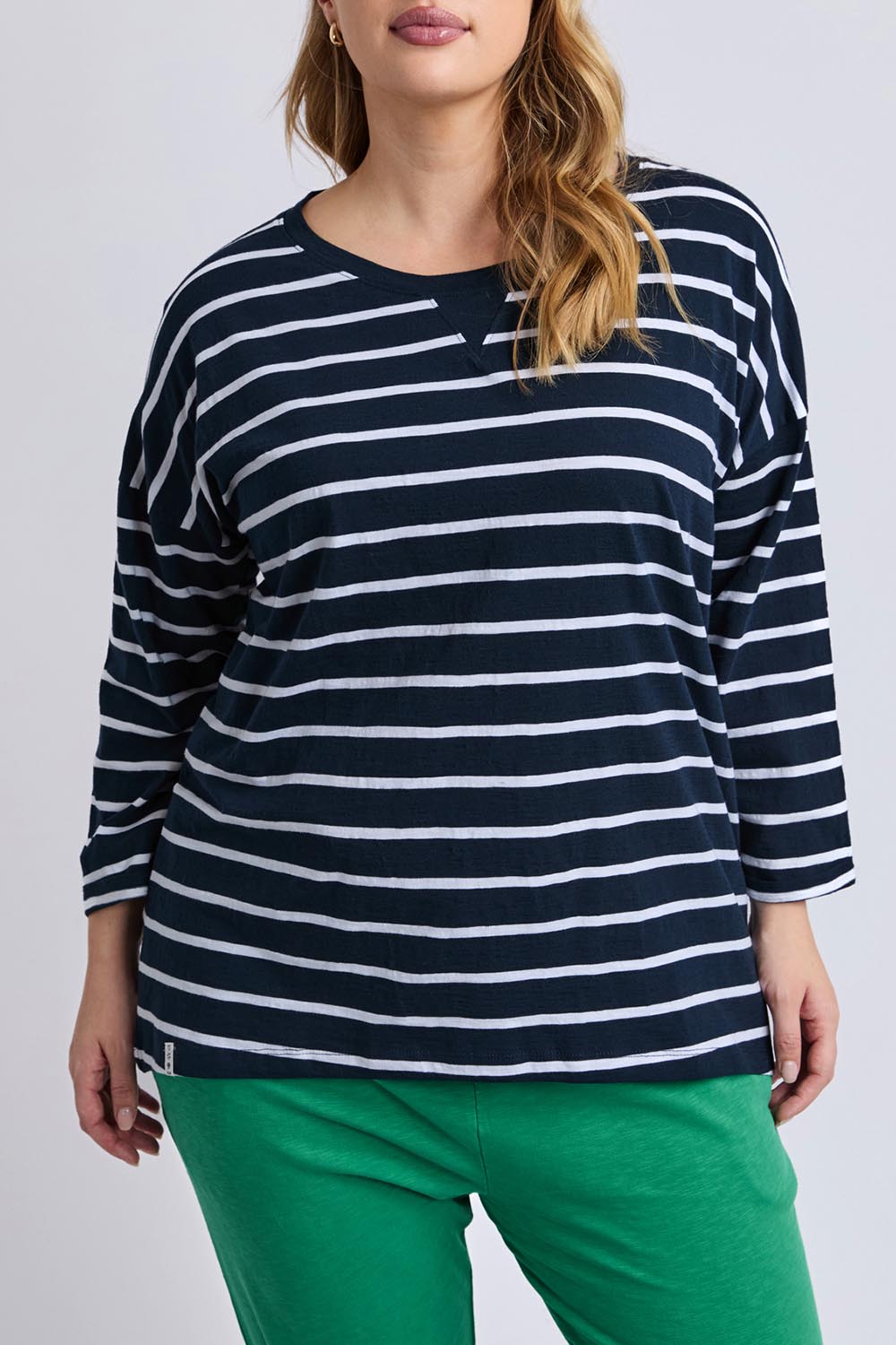 A model wearing the Fundamental Annie 3/4 Slv Stripe CottonTee in colour Navywhtstr (Blue), from the front, cropped image