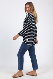 A model wearing the Fundamental Annie 3/4 Slv Stripe CottonTee in colour Navywhtstr (Blue), from the front, showing the whole outfit