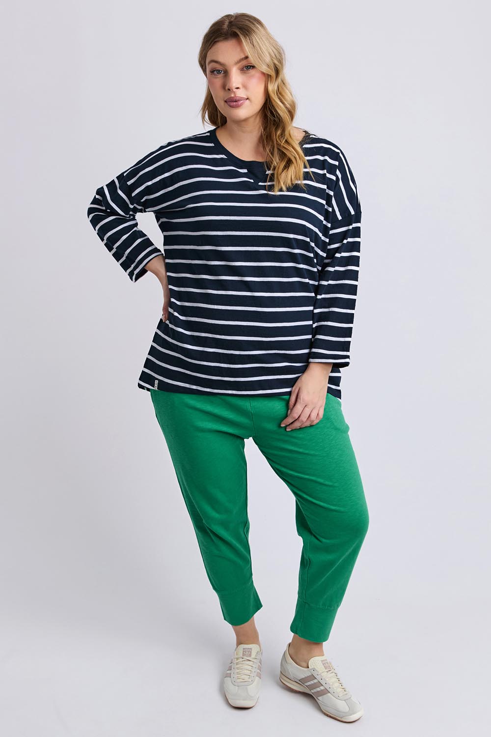 A model wearing the Fundamental Annie 3/4 Slv Stripe CottonTee in colour Navywhtstr (Blue), from the front, showing the whole outfit