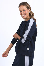 A model wearing the Fundamental Sloane Cotton Fleece Crew in colour Navy (Blue), from the front, cropped image