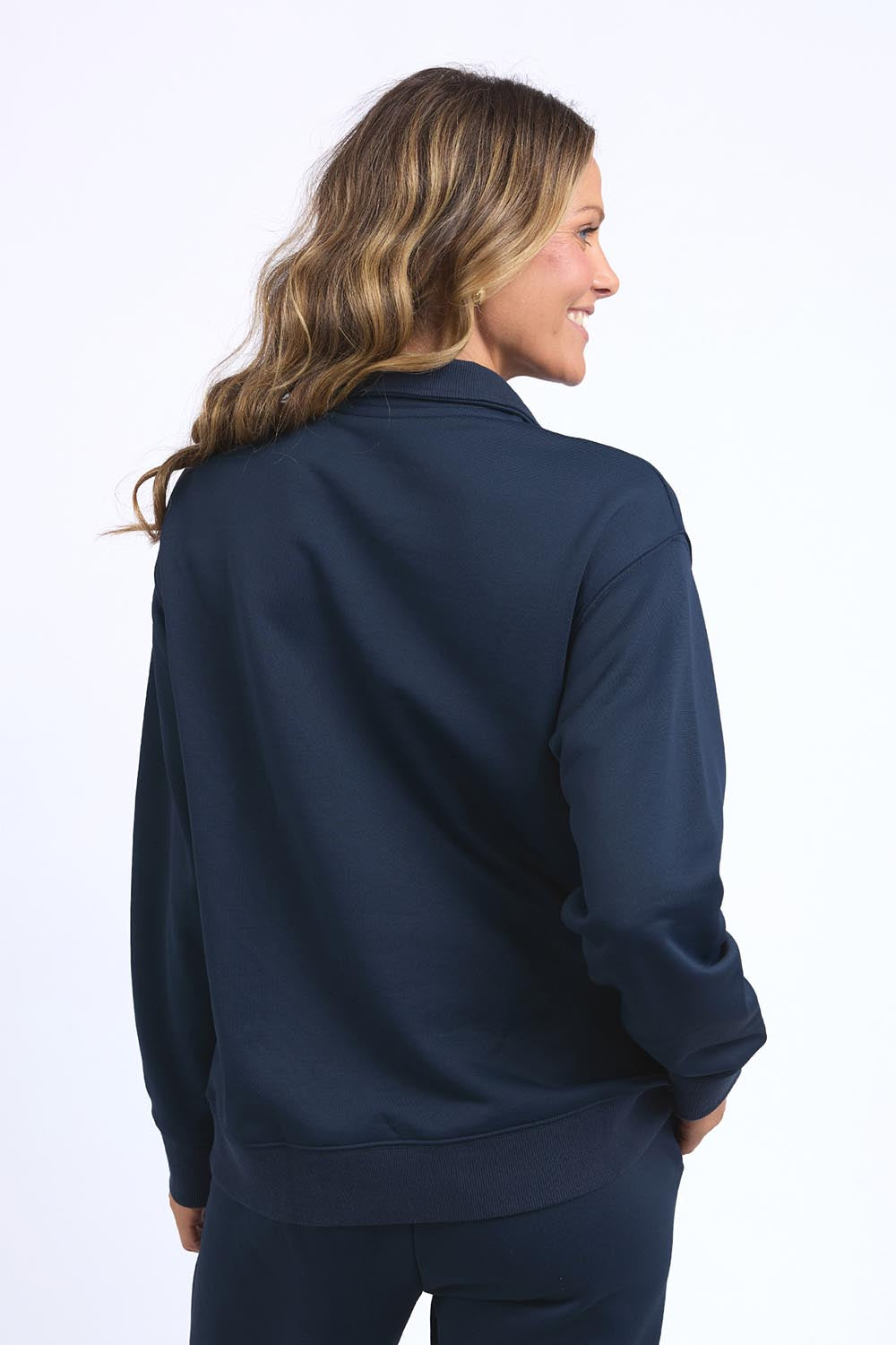 A model wearing the Fundamental Tatum Half Zip Cotton Blend Sweat in colour Navy (Blue), from the back