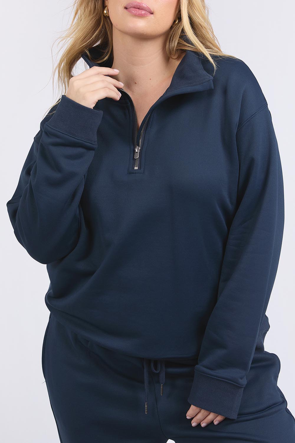 A model wearing the Fundamental Tatum Half Zip Cotton Blend Sweat in colour Navy (Blue), from the front, cropped image