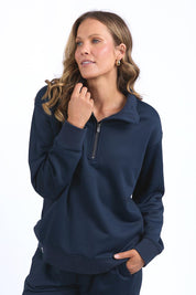 A model wearing the Fundamental Tatum Half Zip Cotton Blend Sweat in colour Navy (Blue), from the front, cropped image