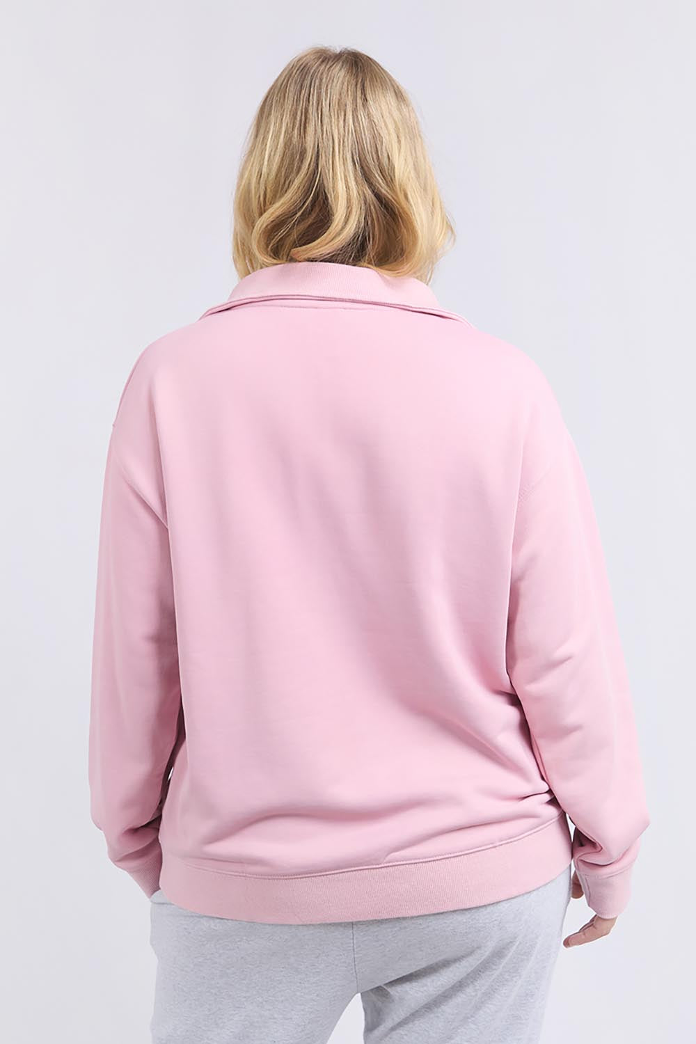 A model wearing the Fundamental Tatum Half Zip Cotton Blend Sweat in colour Softpink (Pink), from the back