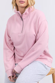 A model wearing the Fundamental Tatum Half Zip Cotton Blend Sweat in colour Softpink (Pink), from the front, cropped image