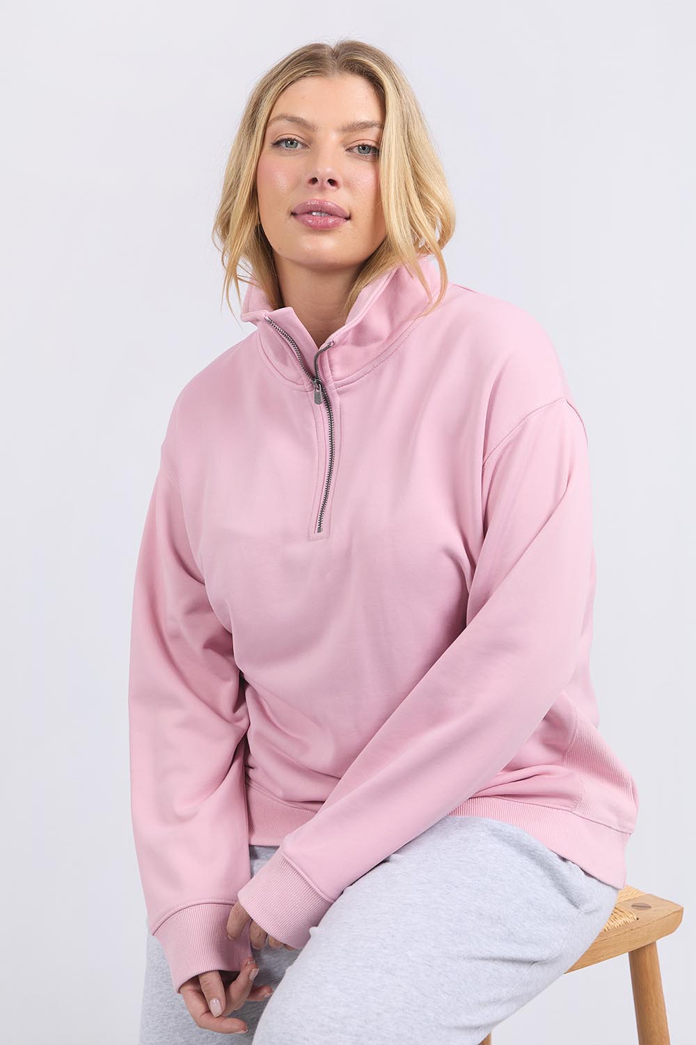 A model wearing the Fundamental Tatum Half Zip Cotton Blend Sweat in colour Softpink (Pink), from the front, cropped image