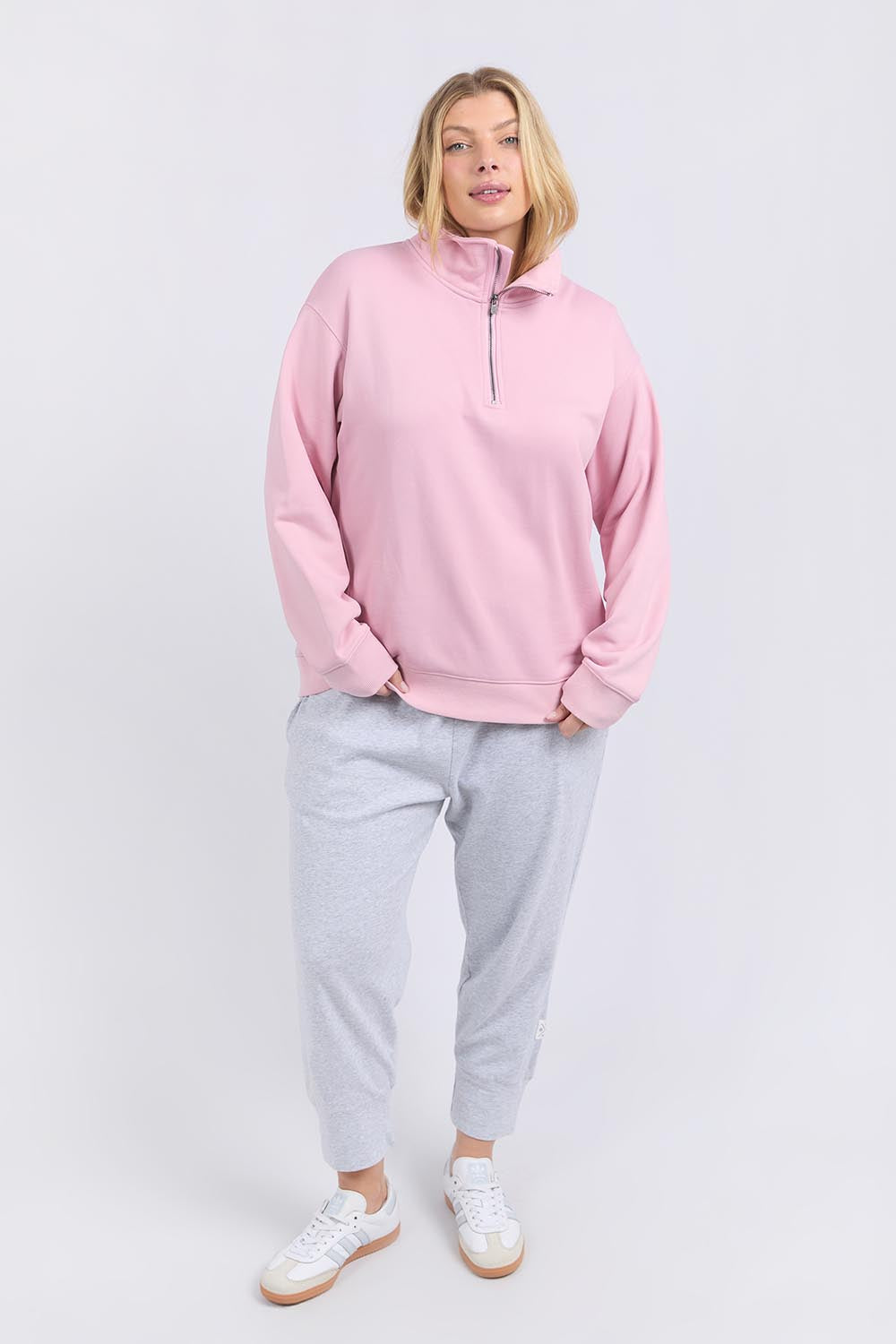 A model wearing the Fundamental Tatum Half Zip Cotton Blend Sweat in colour Softpink (Pink), from the front, showing the whole outfit