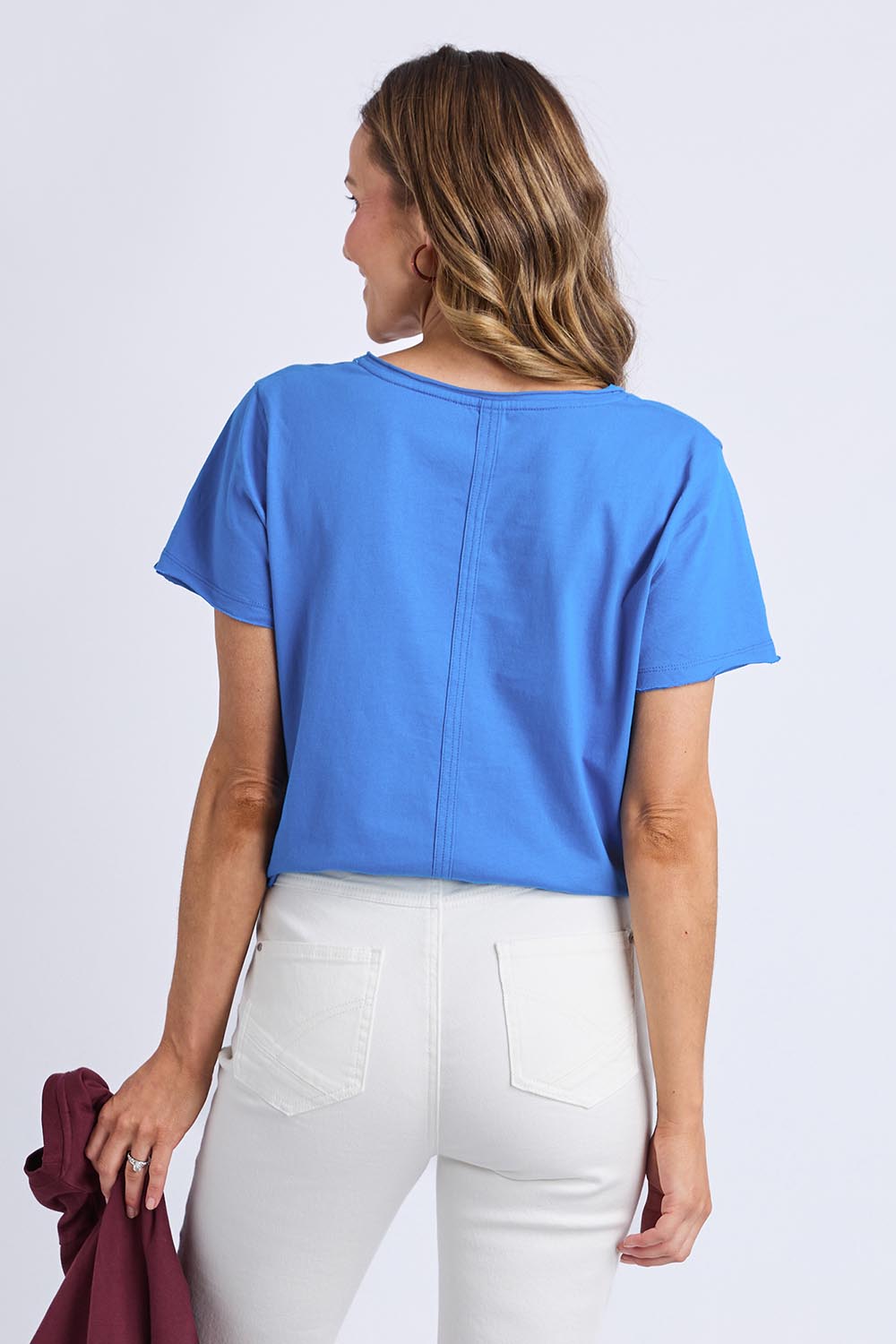 Model Genericm wearing size sample of the Fundamental Pima Cotton Vee Tee - Azureblue in colour Azureblue, from the back