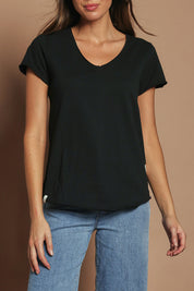 Model Madeline wearing size 10 of the Fundamental Pima Cotton Vee Tee in colour Black (Black), from the front, cropped image