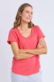 A model wearing the Fundamental Pima Cotton Vee Tee in colour Cayenne (Red), from the front, cropped image