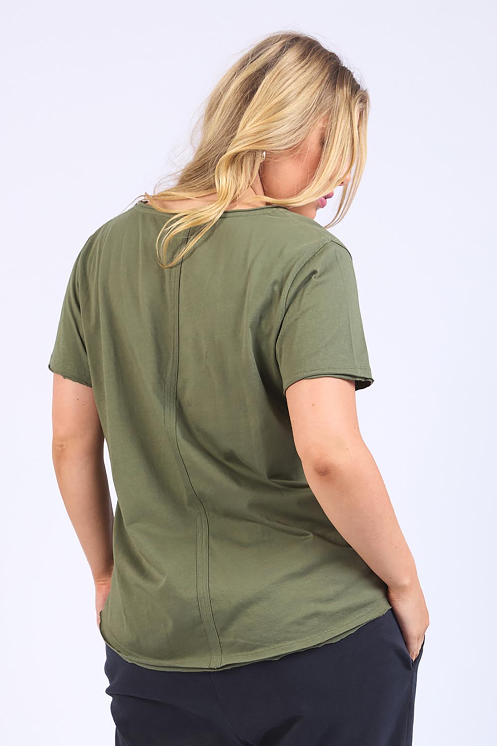 A model wearing the Fundamental Pima Cotton Vee Tee in colour Khaki (Green), from the back