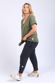 A model wearing the Fundamental Pima Cotton Vee Tee in colour Khaki (Green), from the front, showing the whole outfit
