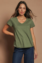 Model Madeline wearing size 10 of the Fundamental Pima Cotton Vee Tee in colour Khaki (Green), from the front, cropped image