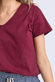 A model wearing the Fundamental Pima Cotton Vee Tee in colour Plum (Purple), from the front, cropped image