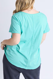 A model wearing the Fundamental Pima Cotton Vee Tee in colour Poolblue (Blue), from the back