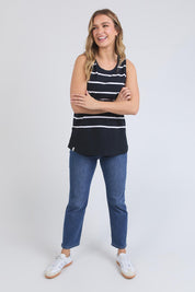 A model wearing the Fundamental Rib Stripe Cotton Tank in colour Navystripe (Blue), from the front, showing the whole outfit