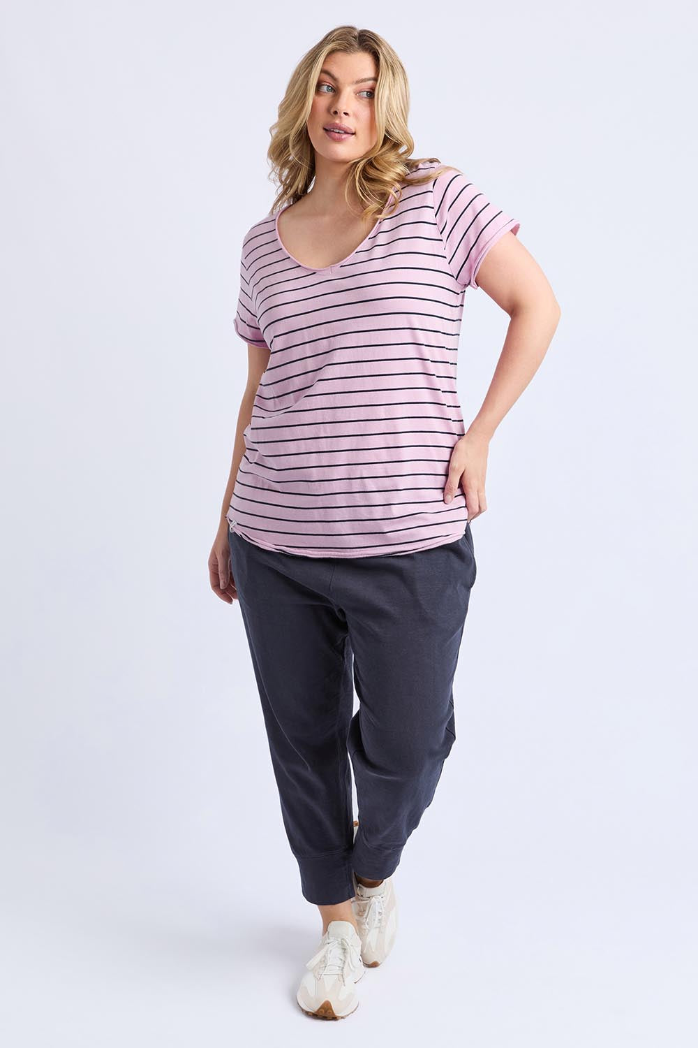 A model wearing the Fundamental Pima Cotton Stripe Vee Tee in colour Pinknavy (Pink), from the front, showing the whole outfit