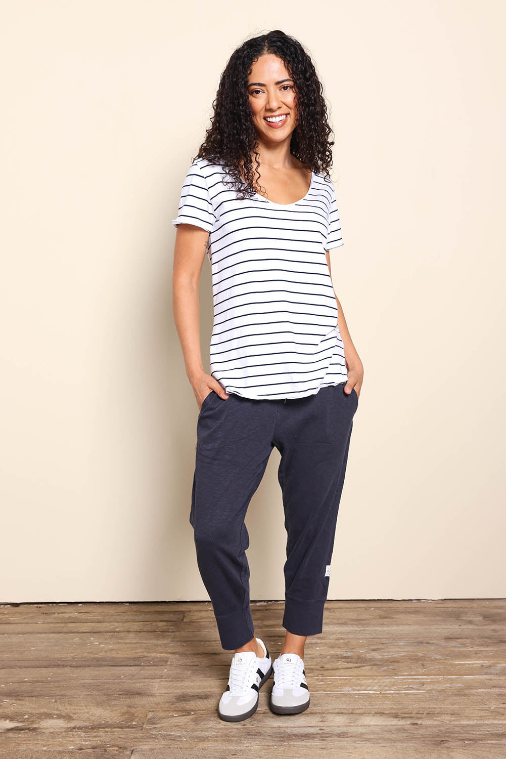 Model Pamelar wearing size 10 of the Fundamental Pima Cotton Stripe Vee Tee - Whitenavy in colour Whitenavy, from the front