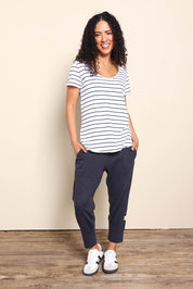 Model Pamelar wearing size 10 of the Fundamental Pima Cotton Stripe Vee Tee - Whitenavy in colour Whitenavy, from the front