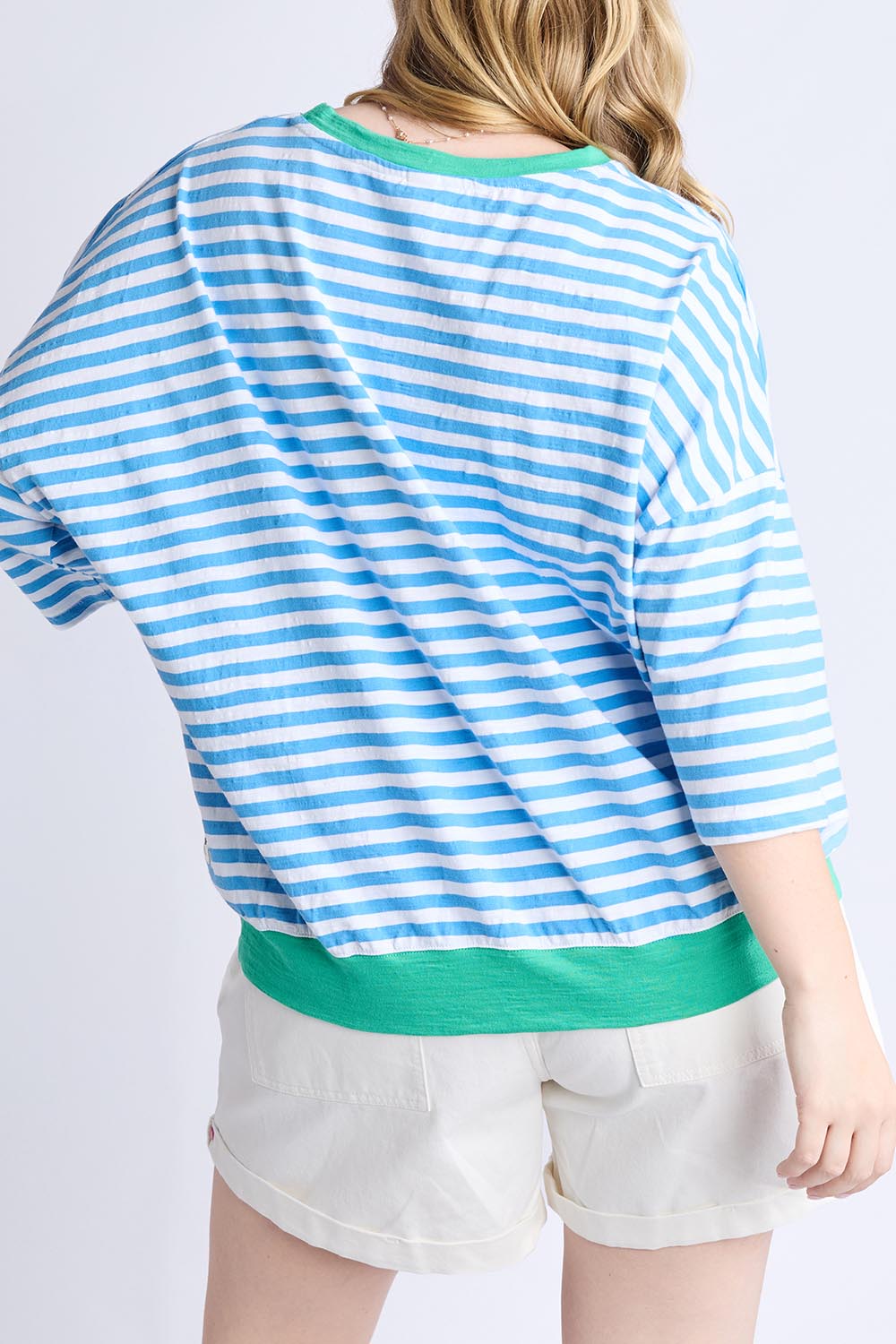 A model wearing the Fundamental Mazie Ringer Cotton Sweat in colour Azurewhite (Blue), from the back