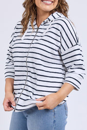 A model wearing the Fundamental Beachy Cotton Hoodie in colour Whitenavy (White), from the front, cropped image