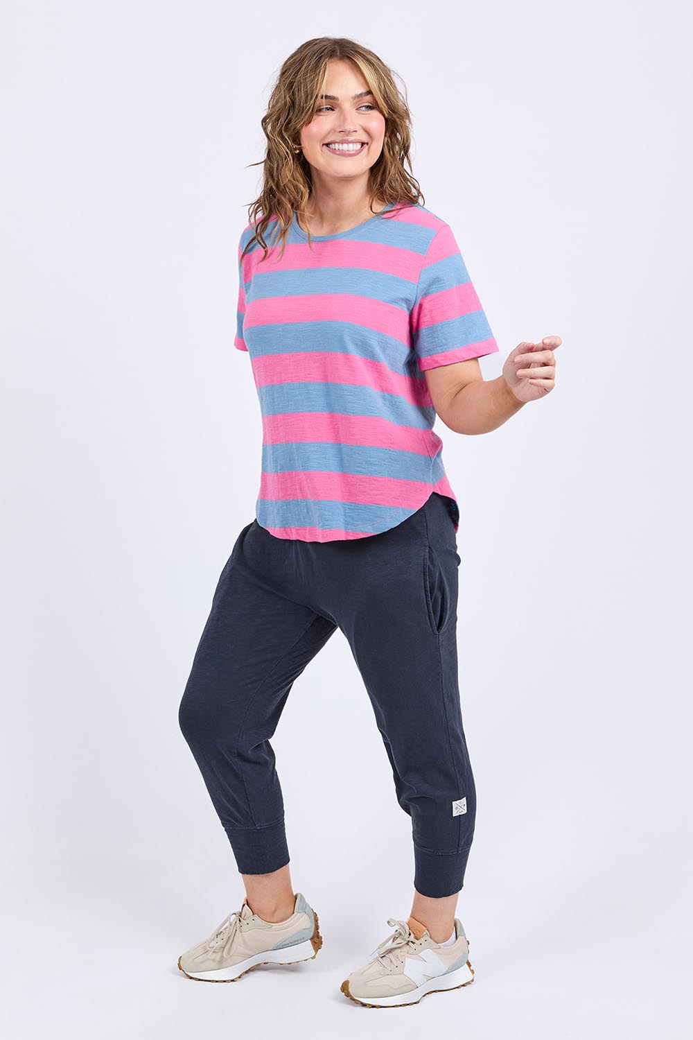 A model wearing the Fundamental Spritz Stripe Ss Cotton Tee in colour Bluepink (Blue), from the front, showing the whole outfit