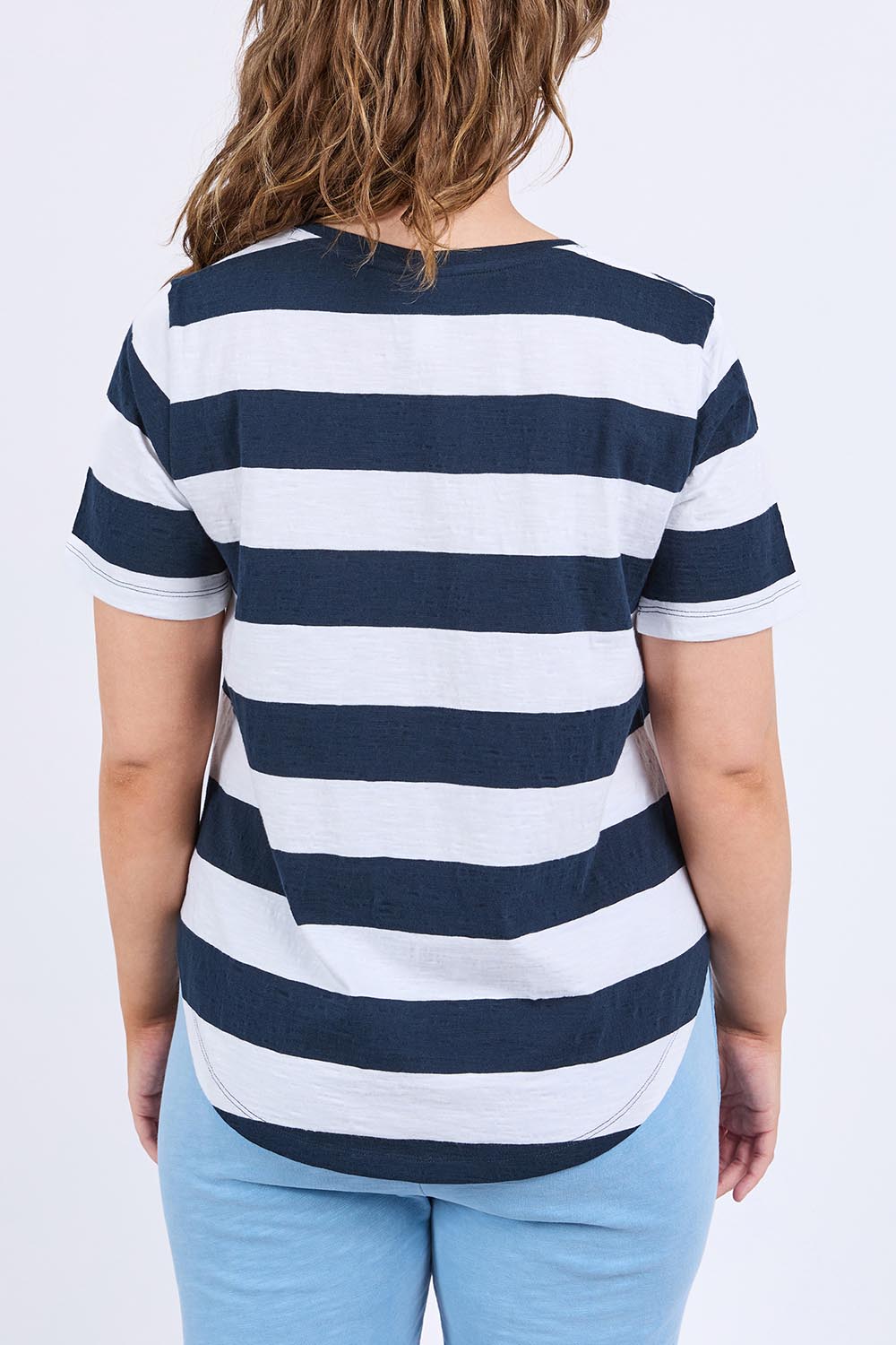 A model wearing the Fundamental Spritz Stripe Ss Cotton Tee in colour Navywhite (Blue), from the back