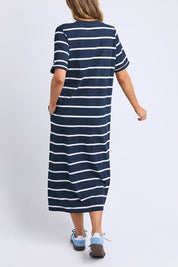 A model wearing the Fundamental Halli Cotton Tee Dress in colour Navywhite (Blue), from the back