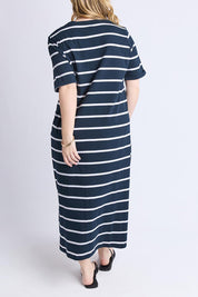 A model wearing the Fundamental Halli Cotton Tee Dress in colour Navywhite (Blue), from the back