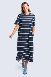 A model wearing the Fundamental Halli Cotton Tee Dress in colour Navywhite (Blue), from the front, showing the whole outfit