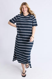 A model wearing the Fundamental Halli Cotton Tee Dress in colour Navywhite (Blue), from the front, showing the whole outfit