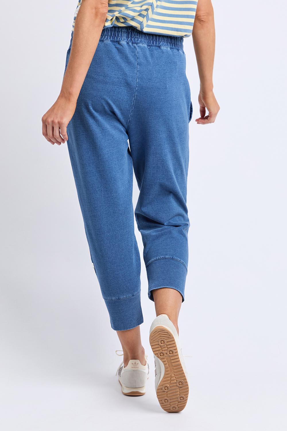 A model wearing the Fundamental Brunch Denim Look Pant in colour Bluedenim (Blue), from the back