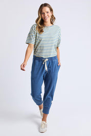 A model wearing the Fundamental Brunch Denim Look Pant in colour Bluedenim (Blue), from the front, showing the whole outfit