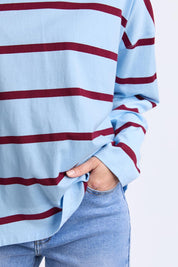 A model wearing the Fundamental Calli Stripe Cotton Long Sleeve Tee in colour Blueplum (Blue), from the front, cropped image