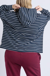 A model wearing the Fundamental Rhea Stripe Cotton Hoodie in colour Navystripe (Blue), from the back