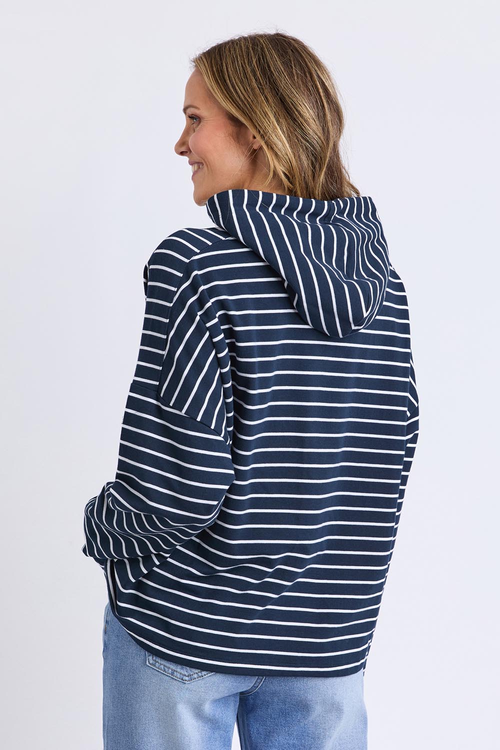A model wearing the Fundamental Rhea Stripe Cotton Hoodie in colour Navystripe (Blue), from the back